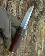 The m390 powder steel puukko knife.