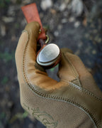 The hand made puukko, n690 blade, curly birch/antler handle, leather sheath.
