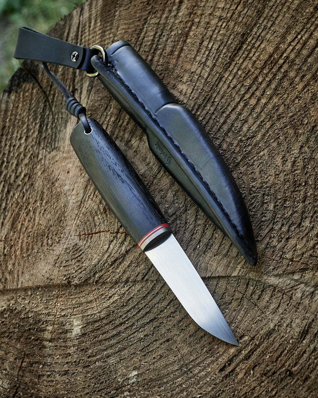 The puukko knife AEB-L steel, stab bog oak, leather sheath.
